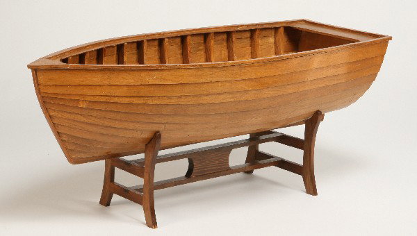 Display size rowboat on stand, 54" long: Adirondack-style display rowboat on stand, 54"l x 21.5"h (with stand).