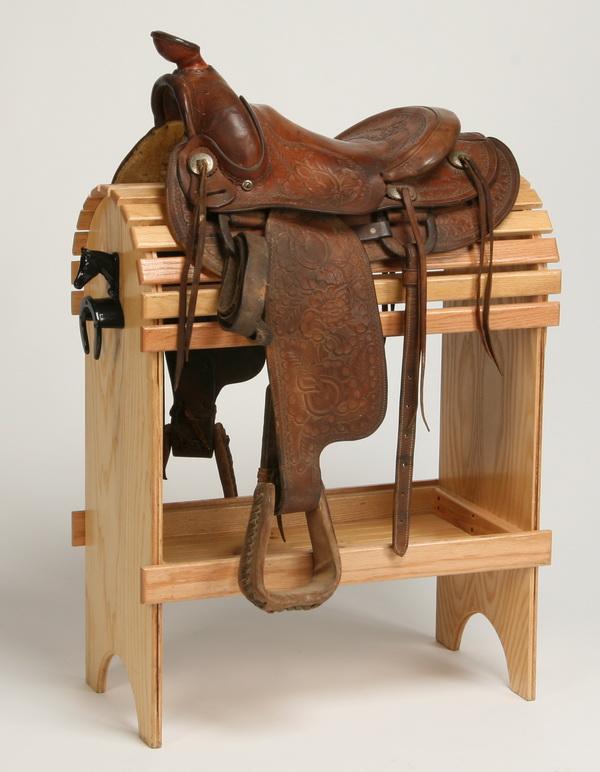 Western saddle by Andy Card: Western saddle in brown tooled leather, maker marked Andy Card, Shawnee, Oklahoma. Display stand NOT included.