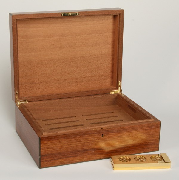Humidor crafted in Italy: Satinwood humidor, with two tier compartmentalized interior, 6"h x 16"w x 12"d.