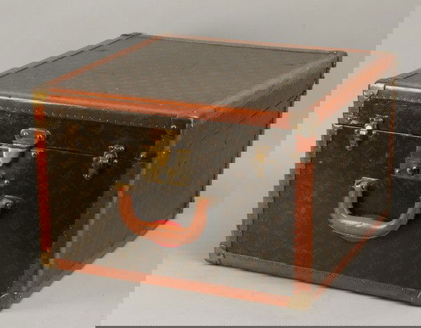 19th c. Louis Vuitton case: Late 19th or early 20th century Louis Vuitton shoe and hat case with original silk damask fitted interior, and original key, 12"h x 18"l x 18"d.