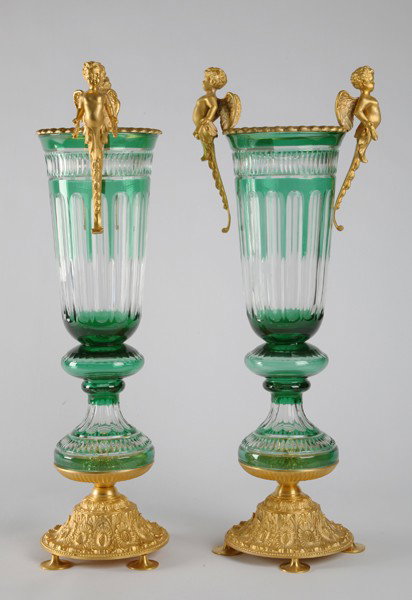 Pair of oversized emerald crystal vases, 32"h: Pair of emerald cut crystal pedestal vases with dorè bronze cherub handles and footed base, 32"h.