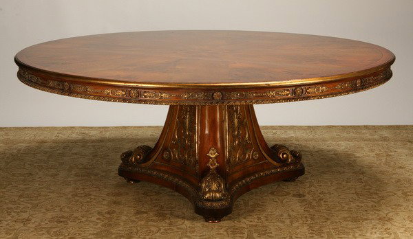 Carved and parcel gilt dining table, 77" diam: George III-style carved and parcel gilt mahogany dining table on tripod base, 31"h x 77"diam.