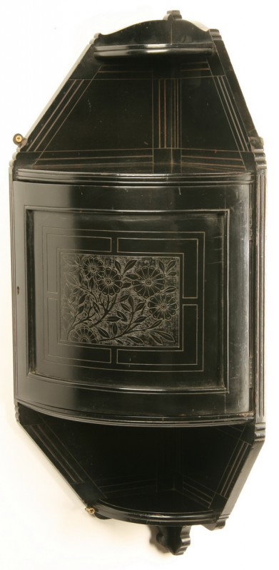 Ebonized walnut corner "what not" cabinet: Ebonized walnut wall mounted corner "what not" cabinet with incised floral designs, 30"h x 16"w.