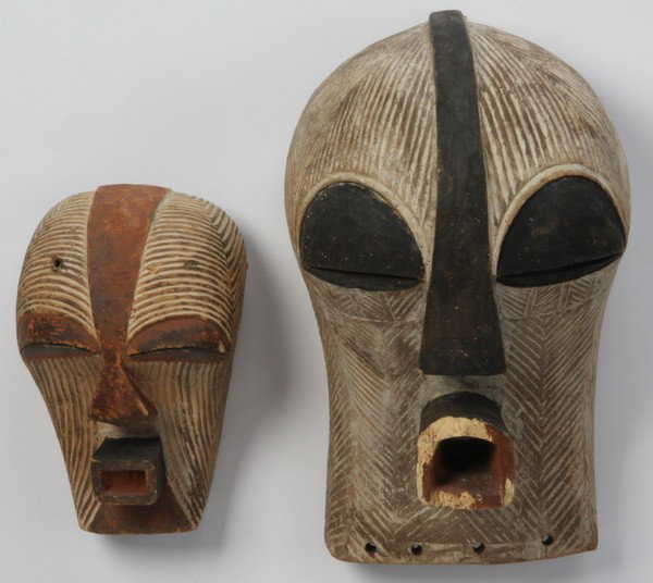 Pair of hand carved African masks: Pair of hand carved and decorated African masks from the Basongye tribe of Zaire, 9"h x 5.75"w; 14"h x 9"w