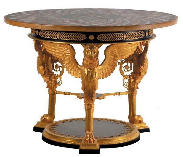 Bronze mounted pietra dura inlaid table: Pietra dura inlaid marble top center table with geometric designs, supported by dore' bronze winged lions terminating in a bronze mounted circular base, 60"diam.