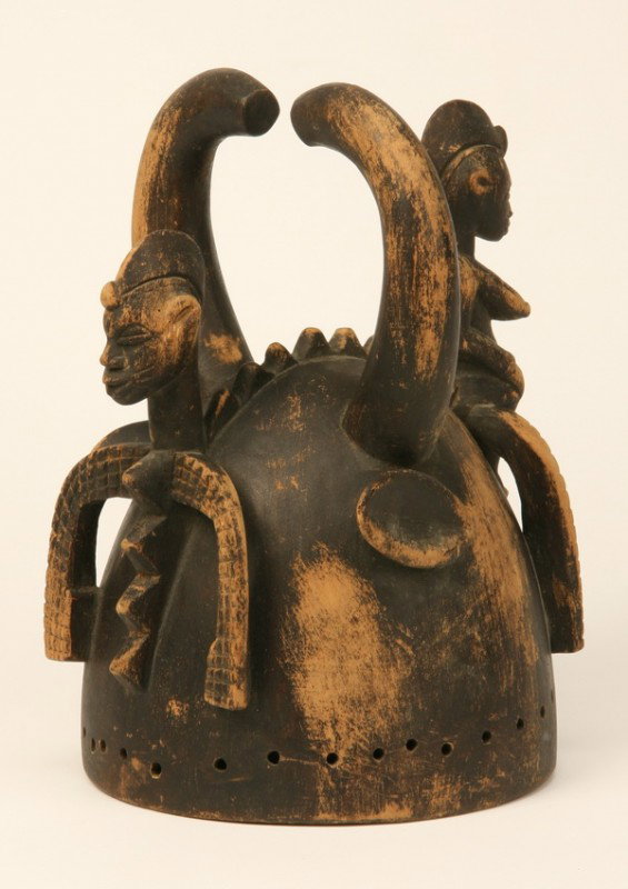 Hand carved African wood helmet: Hand carved wood helmet crafted by the Senufo tribe in Africa, 12.5"h x 8.5"w x 9"d at the base.