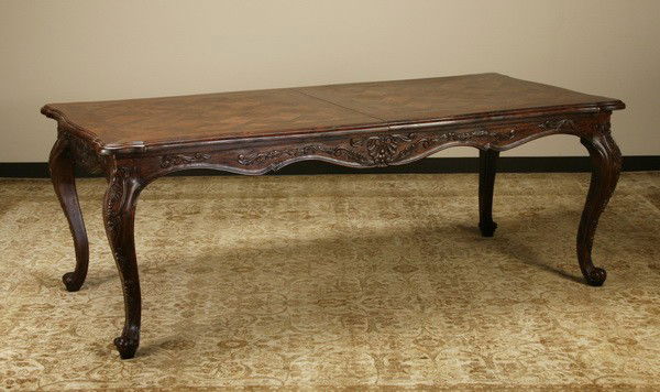 French Provincial style oak dining table: French Provincial style oak dining table with parquetry inlaid top and hidden center leaf, 30"h x 38"w x 82.5"l (103" long with leaf).