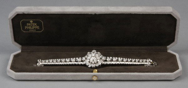 Vintage Patek Philippe diamond bracelet: Ladies' vintage Patek Philippe diamond bracelet with concealed watch, 18kt white gold with 191 brilliant cut diamonds totaling approx. 36 carats, circa 1940.