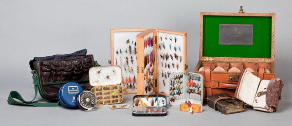 Collection of fly fishing lures & accessories: Extensive collection of fly fishing lures and accessories from England including a vintage leather case with brass fittings and strap closures bearing a paper label Holland & Holland, London with five