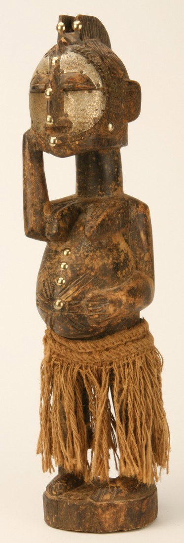 Hand carved African fertility figure: Hand carved African fertility figure crafted by the Abeji tribe of Zaire, 22"h x 4.5"w x 5"d at the base.