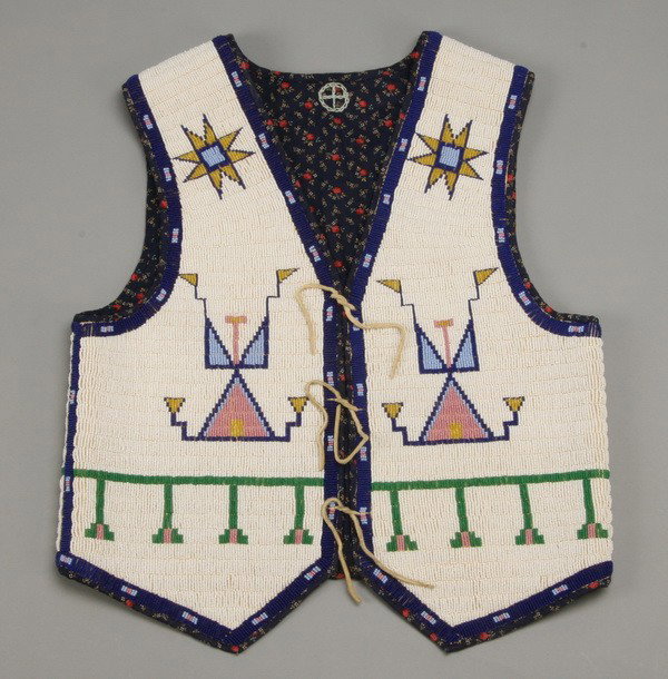Early 20th c. Native American beaded vest: Early 20th century hand sewn Native American Indian beaded child's vest, 20"l x 17"w.