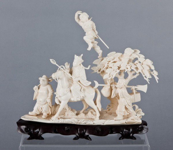 19th c. Chinese carved ivory grouping: Mid 19th century Chinese carved ivory figural grouping representing "The Journey to the West", a well-known fable about Monkey with his three protectors, on fitted zitan wood base, 10"h x 10.5"l x 4"w