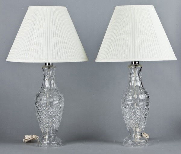 (2) Waterford cut crystal lamps, maker marked: Pair of Waterford cut crystal lamps featuring a cut diamond band at the neck and all over diamond pattern at the bottom half, 31"h to top of harp, 5.5"w at the base, maker marked.