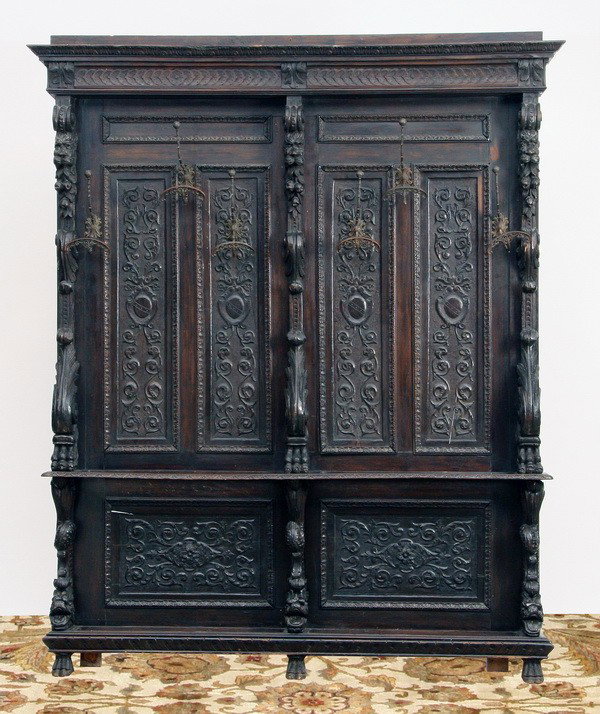 Oversized 19th c. carved walnut hall tree: Oversized 19th century Italian Renaissance Revival carved walnut hall tree, the upper back with relief carved arabesque panels supporting six original wrought iron hat and coat hooks, interspaced by p