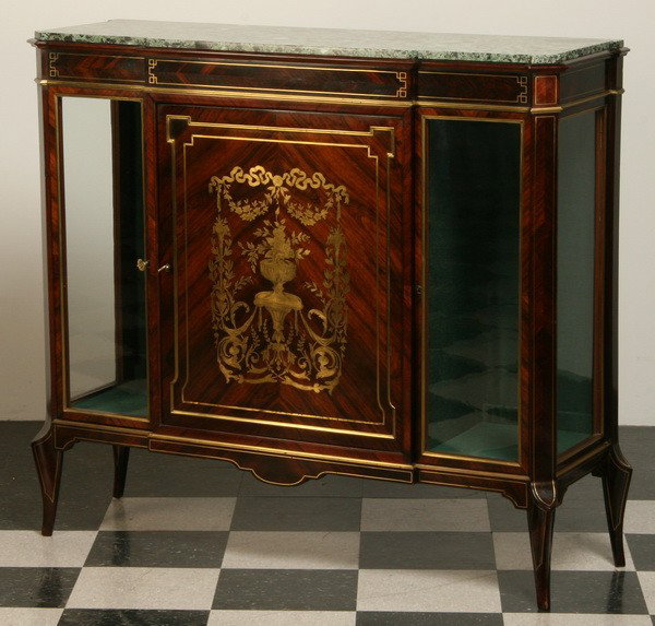 19th c. English Regency brass inlaid cabinet: 19th century English Regency rosewood and satinwood, brass inlaid marble top cabinet with central door featuring a floral design of brass inlay, flanked by glass front display cabinets, 46"h x 52"l x 