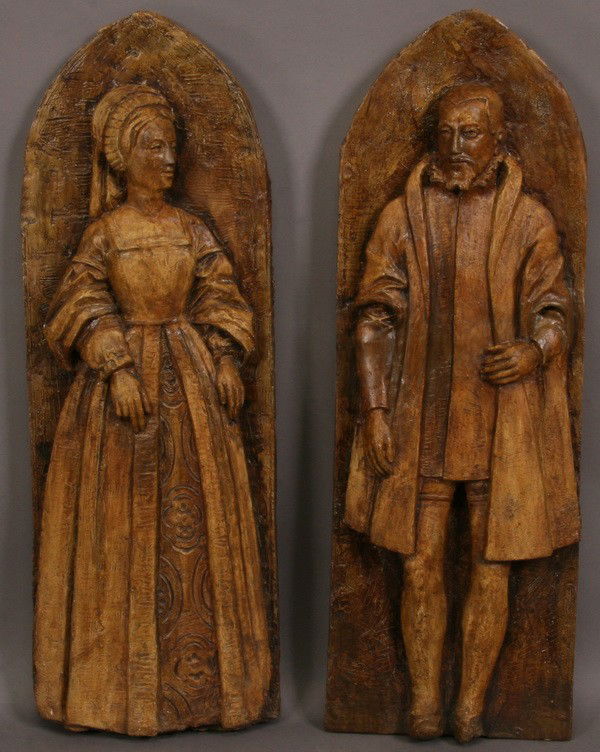 (2) 19th c. English cast plaster wall plaques: Pair of 19th century English cast plaster wall plaques depicting a nobleman and lady in period attire, 34"h x 12"w.