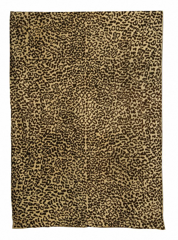 Hand woven rug in a faux leopard design: Hand woven chain stitch rug in a faux leopard design, 9' 3"l x 6' w.
