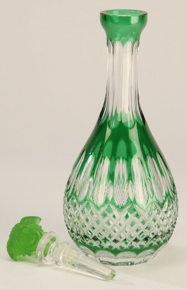 Cut crystal decanter in Versace pattern: Late 20th century Bohemian emerald green cut crystal decanter in Versace pattern, by Rosenthal, 12"h (including stopper) x 3.5" diam. at the base.