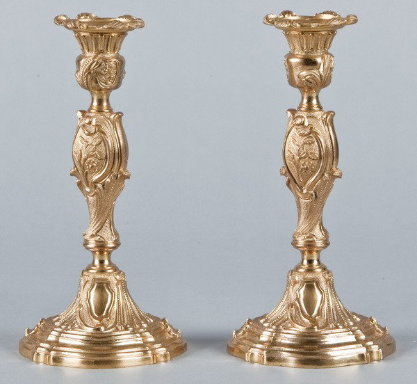 (2) 19th c. dore' bronze candleholders: Pair of late 19th century finely chased Louis XV style dore' bronze candleholders, 9.5"h x 4.5" diameter base.