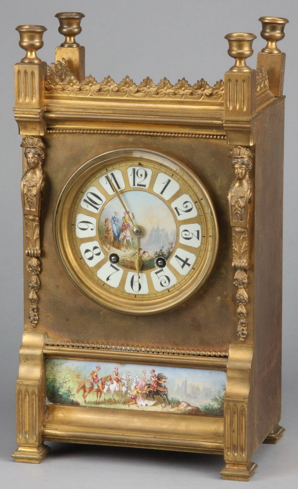 19th c. Neoclassical-style dore' bronze clock: 19th century Neoclassical-style dore' bronze clock with hand painted porcelain face surmounting a hand painted porcelain plaque both depicting lords and ladies on horseback, 14.5"h x 8.5"w x 5.5"d.