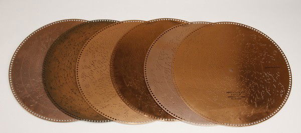 (6) Assorted 20.75" music discs: Group of (6) 20.75" music discs. (1) On the Beautiful Blue Danube by Strauss; (2) Silver Treads Among the Gold; (3) Regina March; (4) The International Rag Song by Berlin; (5) Convent Bells, Reverie b