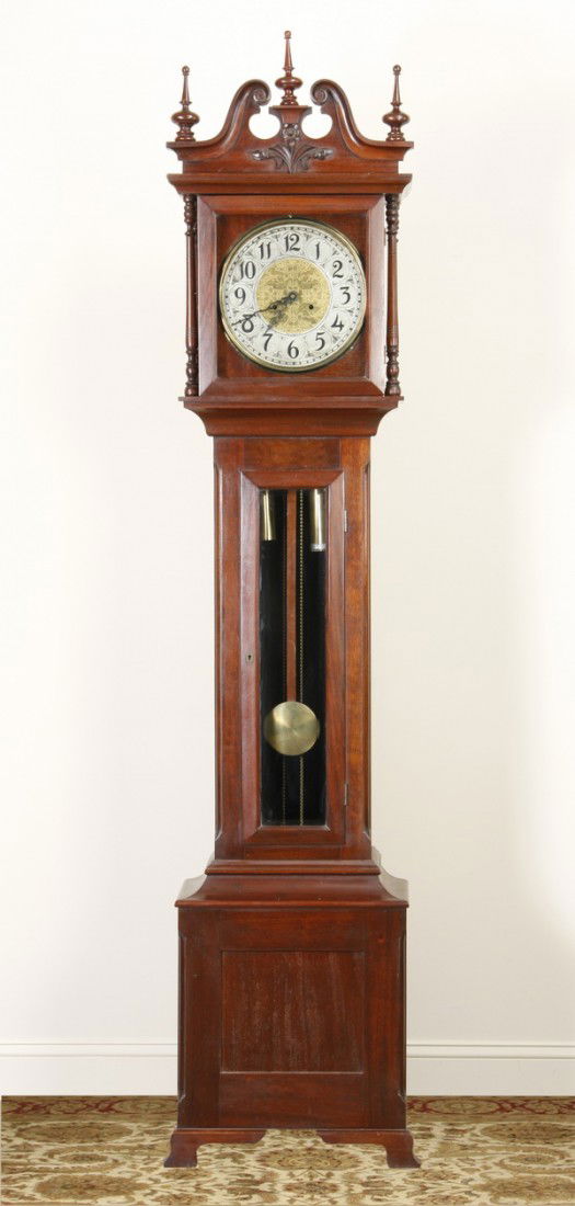 19th c. American tall case clock: 19th century American tall case clock, the mahogany case with broken arch pediment and finely turned finials, maker marked New Haven, USA, 92"h x 20"w x 12.5"d.