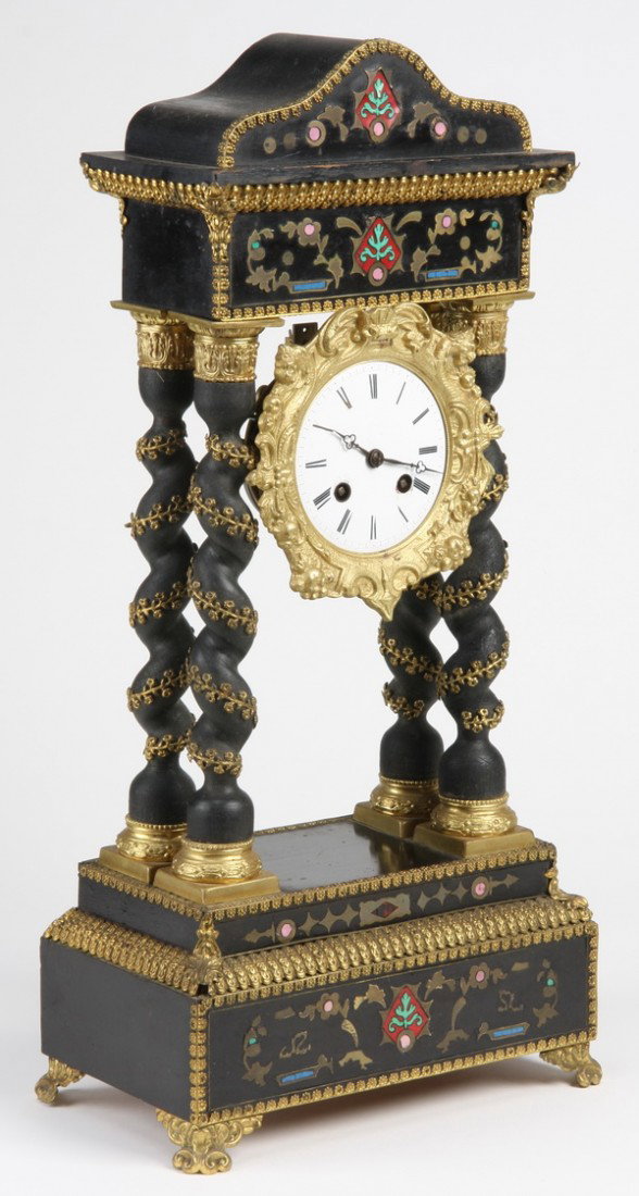 19th c. French Empire bronze inlaid clock: 19th century Napoleon III Empire ebonized and dore' gilt bronze clock with bronze inlaid floral designs on the base and crest, supported by four spiral trwist columns intertwined with brass floral swa