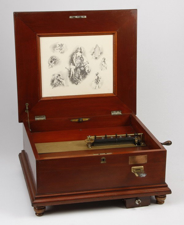 19th c. coin op Regina 15.5" disc player: Rare late 19th century coin operated (one penny) single comb 15.5" disc music box by Regina Music Box Company of Rahway, NJ, with a mahogany case, 11"h x 20.5"w x 18"d.