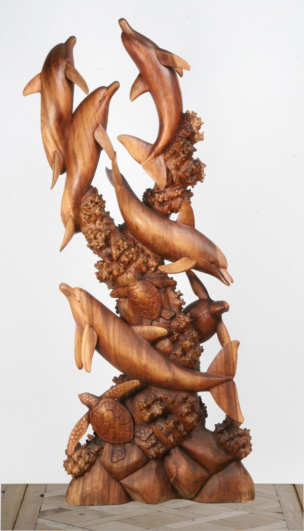 20th c. carved mahogany sculpture: Oversized 20th century carved mahogany figural sculpture depicting a dolphin grouping, 82"h x 30"w x 11"d.