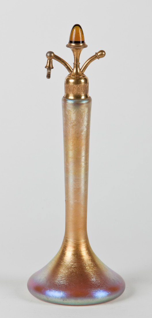 19th c. gold iridescent art glass atomizer: Late 19th or early 20th century gold iridescent art glass atomizer, 10"h x 3.5" diam. base.