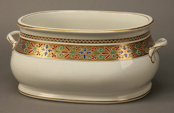 19th c. Minton porcelain foot bath: Late 19th century English porcelain foot bath with gold gilt border and hand applied decorations, marked Minton, 9"h x 19"l x 14"w.