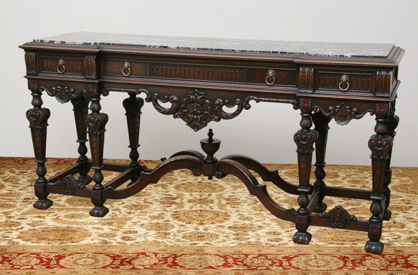 Late 19th c. marble top console: Late 19th century American carved walnut portoro marble top console by Berkey & Gay, Grand Rapids, MI., the side drawers with fitted silverware holders, raised on tapered legs joined by a scrolling st
