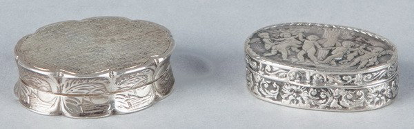Two sterling silver snuff boxes: Two sterling snuff boxes approximately 1.5"w, includes (1) British box with scalloped edges and a geometric pattern on top, maker marked "SJR" (Samuel J. Rose); (1) oval box with an embossed top featu