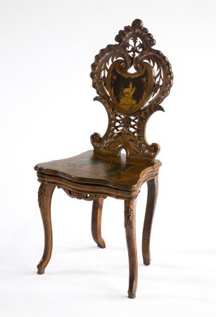 18th c. Black Forest inlaid walnut chair: Late 18th or early 19th century carved walnut marquetry inlaid Black Forest side chair, with pierce carved back and marquetry inlaid seat and backrest, 39"h x 18"w.
