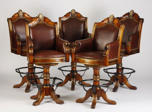 (5) Swivel bar stools upholstered in leather: Set of 5 carved and parcel gilt bar stools upholstered in leather with a faux alligator pattern, on swivel bases with attached footrest, 51"h x 23"w x 19"d.