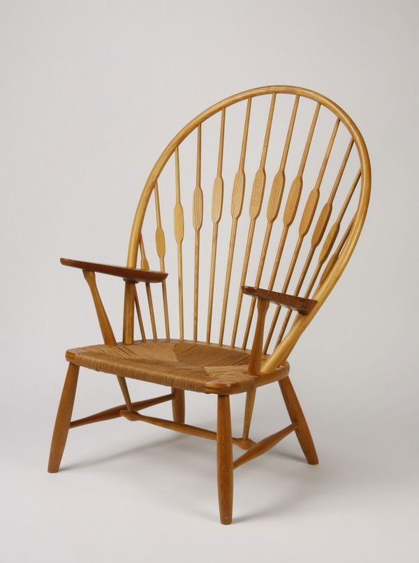 20th c. Hans Wegner Peacock Chair, marked: Mid 20th century "Peacock Chair" designed by Hans Wegner exemplifies the warmth and simplicity of Danish modern design with its hardwood frame and woven cord seat, manufactured by the firm of Joannaes