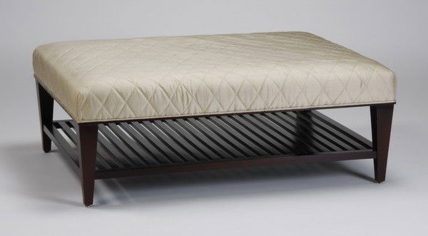 Contemporary Baker Furniture cocktail ottoman: Contemporary cocktail table / ottoman upholstered in ivory quilted silk, with slatted lower shelf, from The Barbara Barry Collection for Baker Furniture, 16"h x 44"w x 33"d.