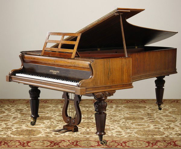 19th c. English rosewood piano: Late 19th century English ebony and rosewood grand piano by John Broadwood & Sons, London, with original ivory keys, 94"l x 54"w.