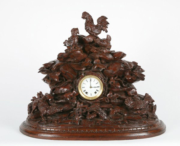 19th c. carved Black Forest mantle clock: 19th century carved walnut Black Forest style mantle clock, maker marked Mitchell Vance & Co., 23"h x 28"w.