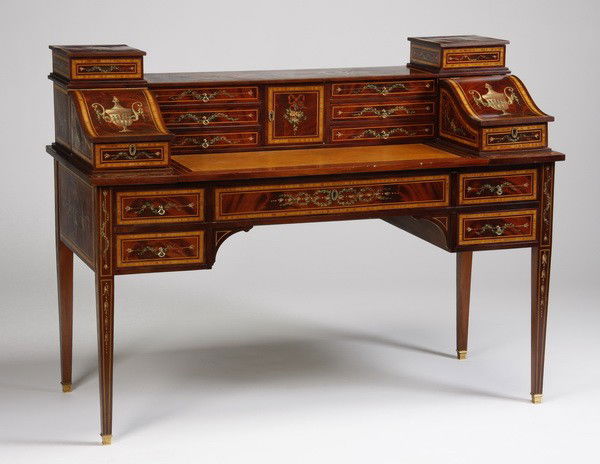 20th c. English Regency style writing desk: 20th century English Regency style mahogany writing desk with marquetry inlay, hand painted details, inset gold tooled leather writing surface, and numerous drawers and compartments for storage, 42"h