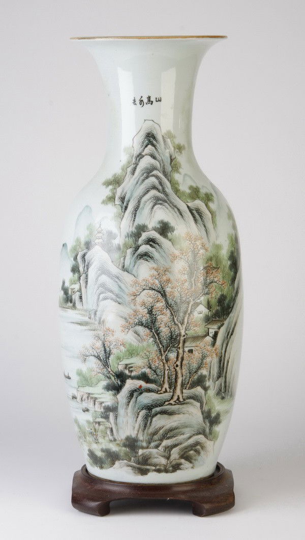 20th c. Chinese earthenware vase: Mid 20th century Chinese earthenware vase on fitted stand, the white ground decorated with a riverside mountain scene, vase: 23"h x 8" diameter at the rim.