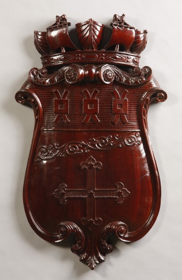 Relief carved armorial shield: Relief carved walnut armorial shield, 35"h x 22"w.