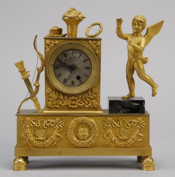 19th c. French bronze figural clock: Late 19th century dore' bronze French figural clock depicting Cupid with bow and quiver, 10.5"h x 9"w x 3.25"d.