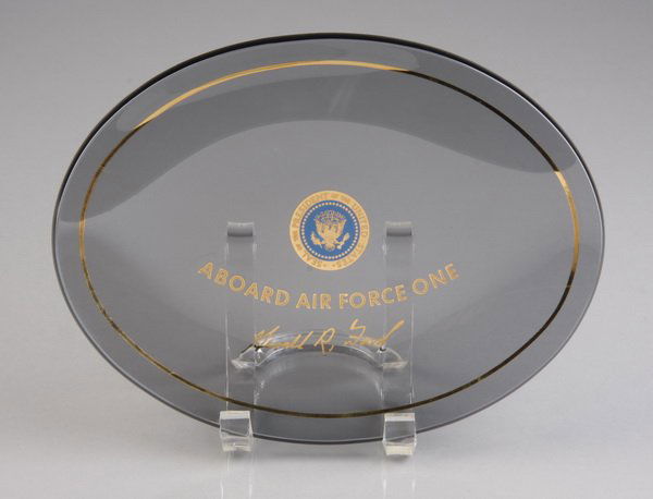 Air Force One glass dish: Ford White House Air Force One glass dish decorated with the Presidential seal, the inscription "Aboard Air Force One" and Gerald Ford's signature, in its original presentation box, dish 8.5"l x 6.25"