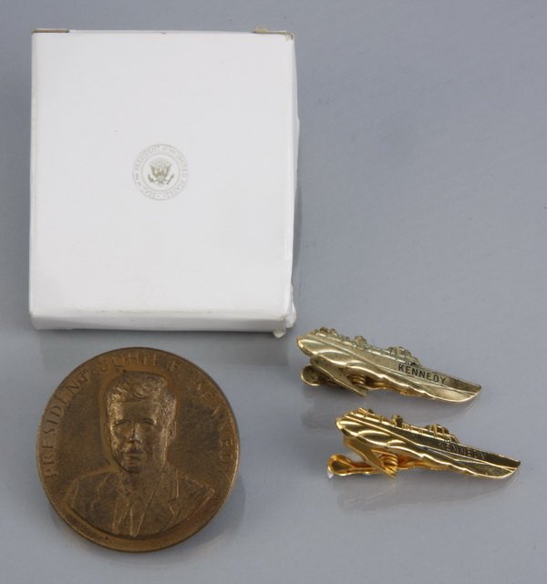 (3) Kennedy White House mementos: Grouping of 3 Kennedy White House mementos: (1) bronze coin, the face with a raised bust of Kennedy encircled by his name "John F. Kennedy", the reverse with a raised Presidential seal, encircled "Wit
