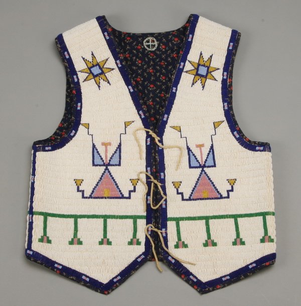 Native American Indian beaded child's vest: Mid 20th century hand sewn and hand beaded Native American Indian child's vest, 20"l x 17"w.