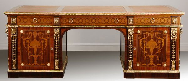 French Empire style inlaid executive desk: French Empire style satinwood, rosewood and marquetry inlaid, gilt bronze mounted executive desk with tripartite gold tooled leather top, 32"h x 84"l x 44"w.