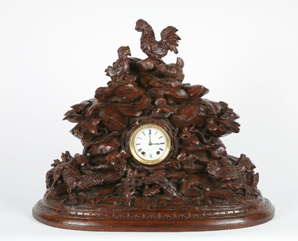 19th c. carved Black Forest mantle clock: 19th century carved walnut Black Forest style mantle clock, maker marked Mitchell Vance & Co., 23"h x 28"w.