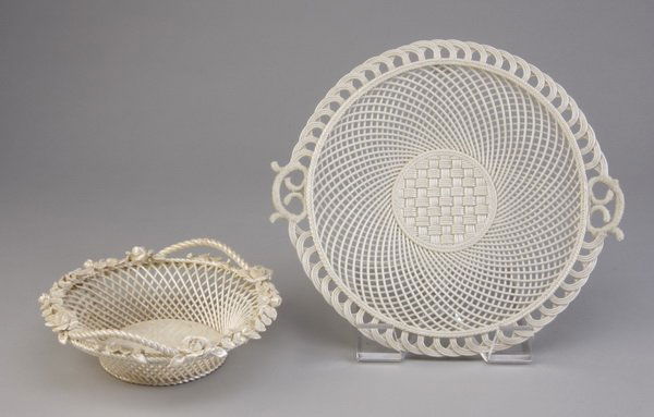 (2) Early 20th c. porcelain dishes, Belleek: Grouping of two early 20th century reticulated white porcelain lusterware dishes. Includes (1) tray with a central basket weave pattern encircled by a radiating diamond pattern, the rim with scalloped