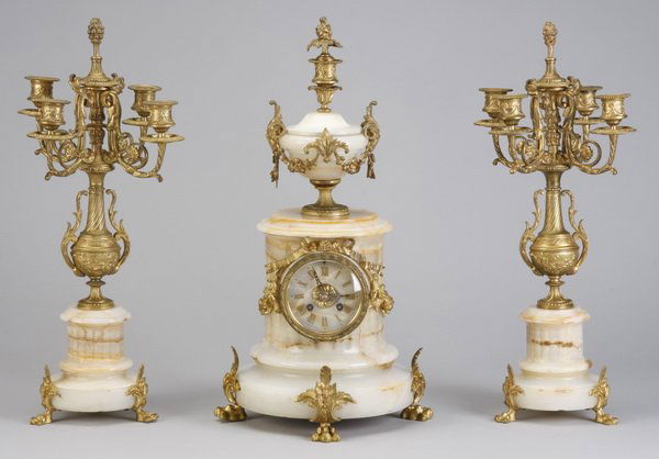 19th c. onyx clock set, marked Tiffany & Co.: Late 19th century gilt bronze mounted Persian onyx 3-piece clock and garniture set, the clock with an onyx face marked "Tiffany & Co., Paris - New York", the matching candelabra in the form of urns is